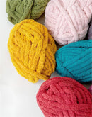Colorful yarn balls on a white background
