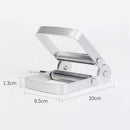 Metallic paper punch with dimensions labeled on a white background
