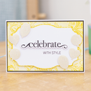 Decorative card with 'celebrate with style' text on a wooden surface