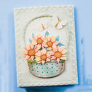 Decorative card with sunflowers and a basket on a textured surface