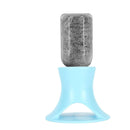Gray bar of soap on a blue stand against a white background