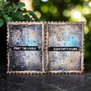 Two rustic books with text and decorative elements on a dark surface with a blurred green background.