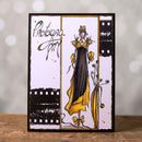 Greeting card with a stylized illustration of a woman in a yellow dress and black top, standing in front of a blurred cityscape.