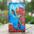Phone case with dragonflies and flowers design on a wooden surface