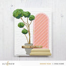 Card with decorative elements including a tree, pink arch, and 'You've Got This!' sign on a white background.