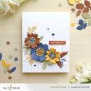 Card with colorful floral design and 'Just for You' text on a wooden surface with decorative elements.