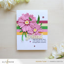 Greeting card with pink flowers and 'friend' text on a striped background, surrounded by white flowers.