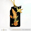 Black tag with gold leaf designs and 'Altenew' branding on a white background