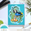 Card with underwater scene featuring fish and plants, surrounded by Altenew products.