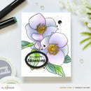 Floral card with 'you make life blossom' text, surrounded by stationery items on a white background.