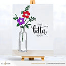Card with flowers in a bottle and 'feel better soon' text on a white background
