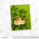 Card with a wooden crate of flowers and leaves on a green background, featuring the brand 'Altenew'.