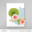 Card with pink flowers and a green lily pad on a white background, featuring the brand 'Altenew'.