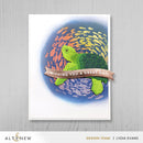 Card with a turtle and 'Wishing you a great day' banner on a colorful ocean background, featuring the brand 'Altenew'.