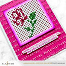 Cross-stitched card with pink border and text, featuring a heart and leaves design.