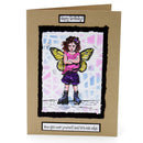 Birthday card with a colorful illustration of a girl with butterfly wings on a brown envelope.