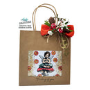 Kraft paper gift bag with decorative elements and a printed design of a fairy.