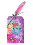 Colorful gift box with owl design and pink feather on a white background