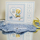 Baby shower card with teddy bear and baby rattle design, featuring Art Impressions branding.