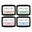 Four ink pads with different colors and labels on a white background