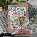 Card with a mouse holding a heart and text 'You make my heart scurry' on a crafting table with stamps and tools.