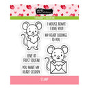 Clear stamps with cartoon mice holding hearts and Valentine's Day text on a pink background with heart pattern.