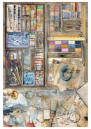 Art supplies including paint palettes, brushes, and other materials on a wooden surface.