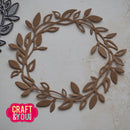 Decorative leaf wreath cutout on a light background with 'Craft & You' logo.