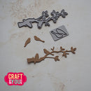 Metal cutting dies shaped like branches and birds on a light surface with 'Craft & You Design' logo.