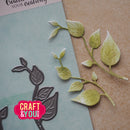 Leaf-shaped cutting dies and cut-out leaves on a paper background with 'Craft & You' branding.