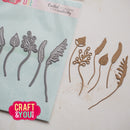 Metal die cut shapes of leaves and flowers on a white surface with 'Craft & You' branding.