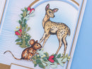 Card with a deer and mouse illustration on a decorative background