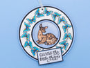 Decorative plate with a deer illustration and butterfly design on a blue background