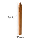 A single wooden crochet hook shown vertically on a white background with size labels reading 20.5 cm and 20 mm.