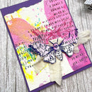 Colorful card with butterfly design on a wooden surface