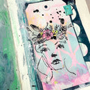 Artistic phone case with a stylized face and floral design on a colorful background