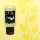 Bottle of Dylusions Antique Cream paint on a yellow background with leaf pattern