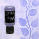 Bottle of illusions paint on a textured purple background with leaf designs