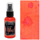 Dylusions ink spray bottle with a sample of orange floral design on paper
