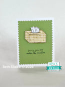 Card with a tissue box design and 'sorry you are under the weather' text on a green background, featuring the Gina K Designs logo.