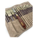 Set of paint brushes in a beige leather case on a white background