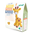 Crocheted giraffe toy with packaging on a white background