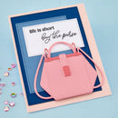 Card with a pink purse design and text 'life is short, buy the purse' on a blue background.