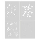 Four white stencils with floral and abstract designs on a gray background