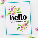 Card with 'hello' and 'you brighten my day' text surrounded by colorful flowers on a white background.