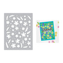 Decorative stencil with floral patterns and a greeting card with flowers and text on a white background.