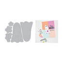 Set of gray die-cut shapes with a small card featuring a ghost and flowers on a white background