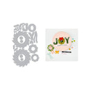 Decorative 'JOY' cutout with a Christmas-themed card on a white background