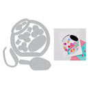 Metal die cutters with a colorful card featuring a paint palette design on a white background
