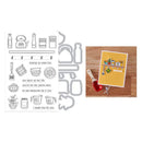 Metal die cutters with kitchen-themed stamps and a card with a red heart on a wooden surface.